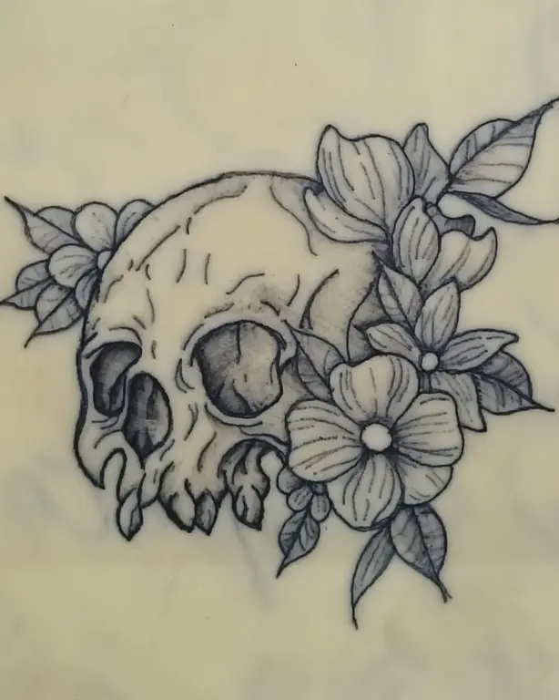 Cráneo entre flores y hojas, en línea y sombreado suave.